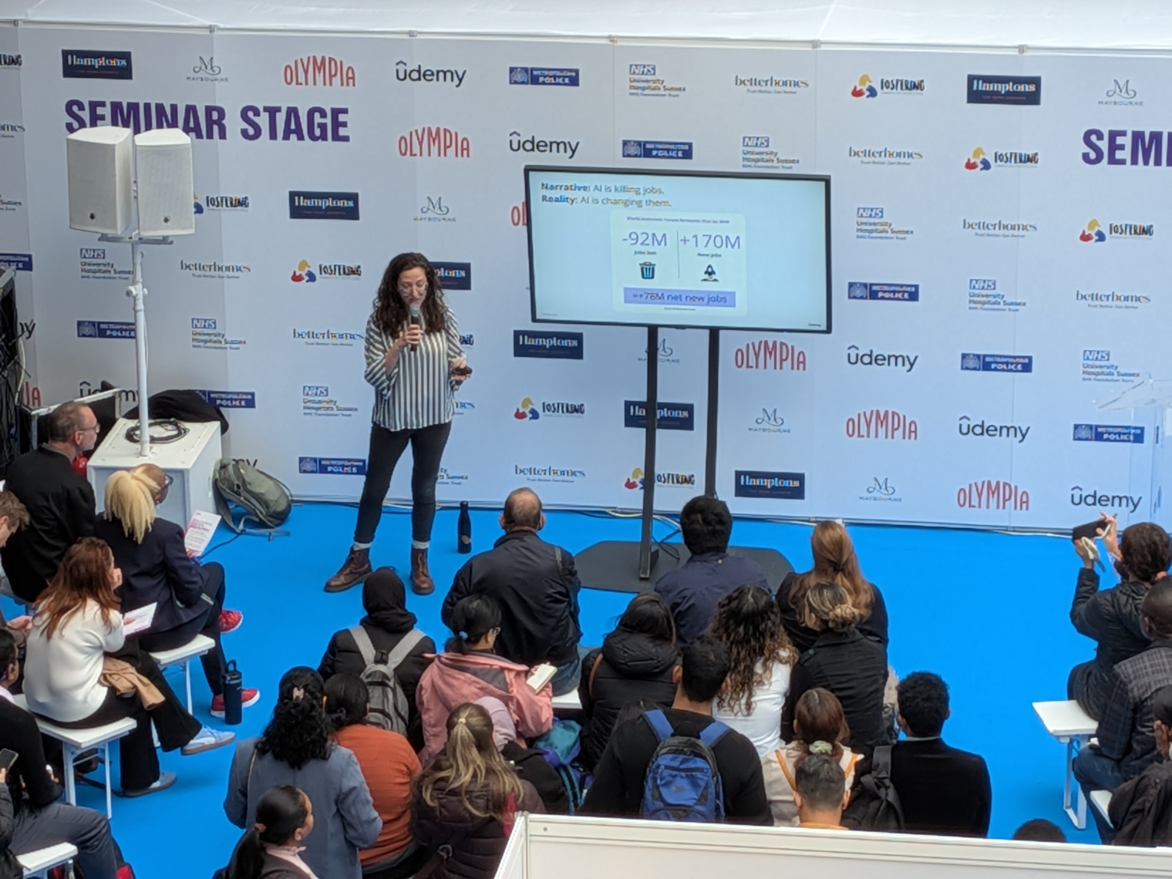 Rachel presenting on stage
